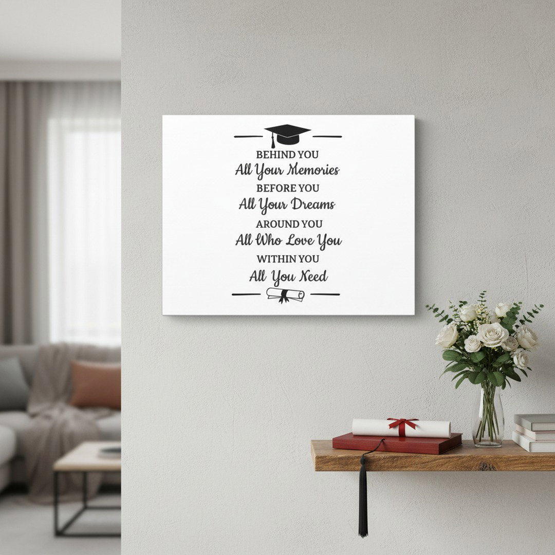 Graduation quote canvas hanging on gray wall above wood shelf with white roses and diploma scroll, elegant graduation gift wall art