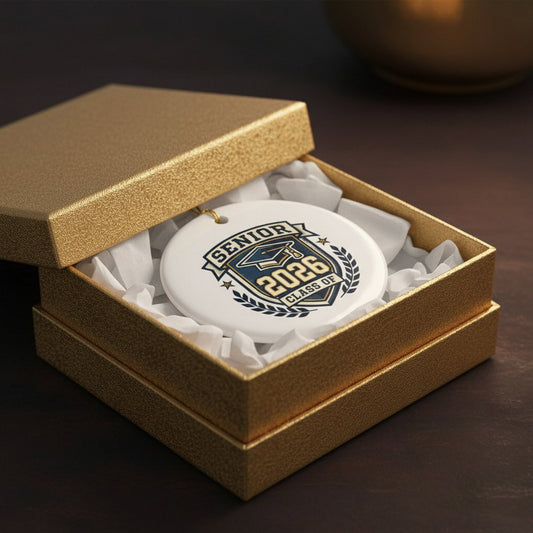 Senior 2026 graduation ceramic ornament in open gold gift box with white tissue paper, luxury graduation keepsake gift presentation