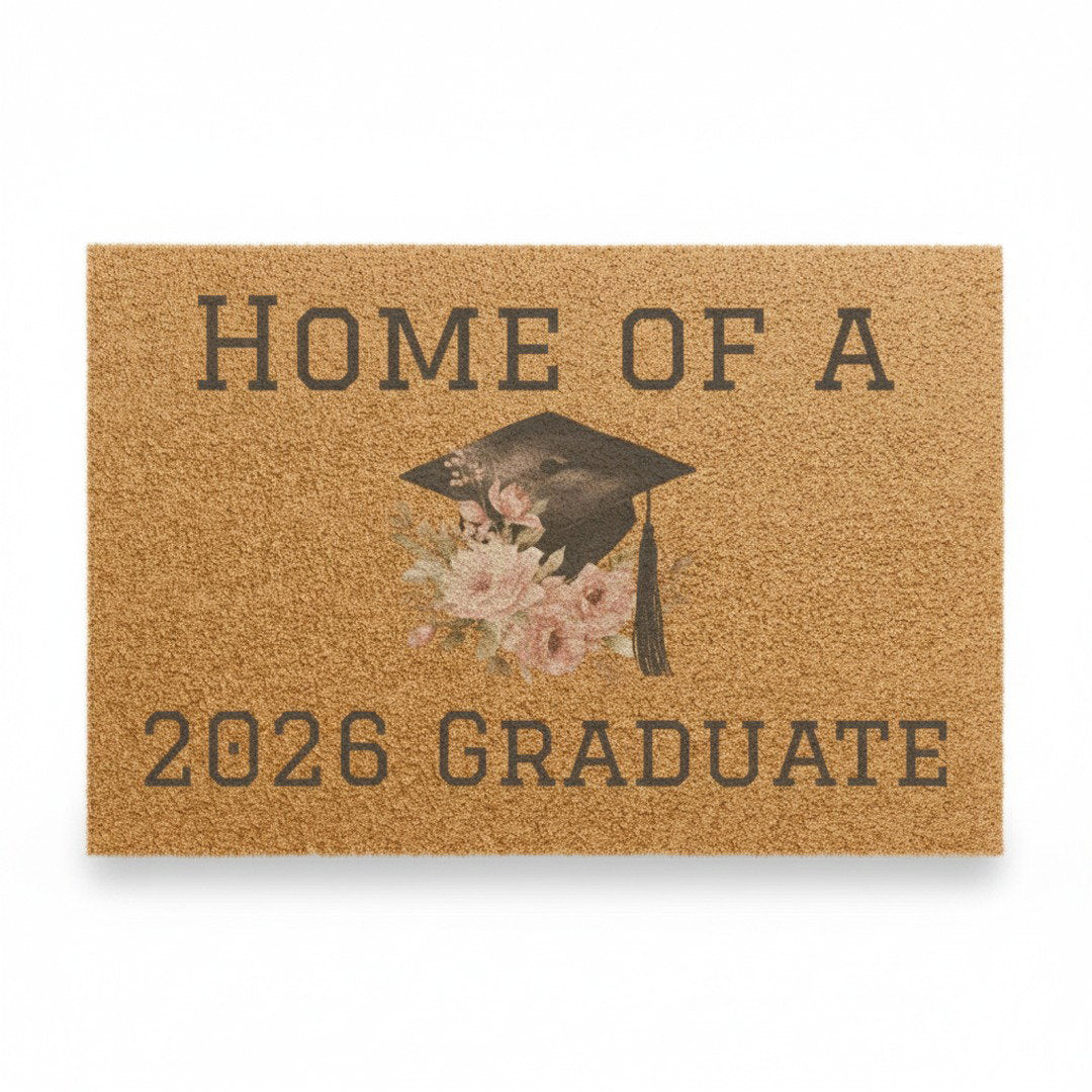 Home of a 2026 Graduate coir doormat with floral graduation cap design on white background, natural coconut fiber graduation welcome mat