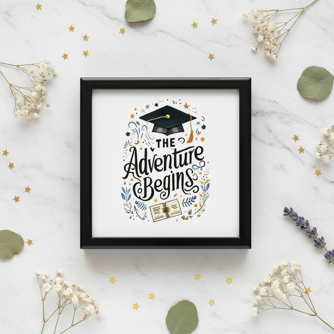 The Adventure Begins graduation keepsake box overhead view on white marble with gold star confetti, eucalyptus, and baby's breath