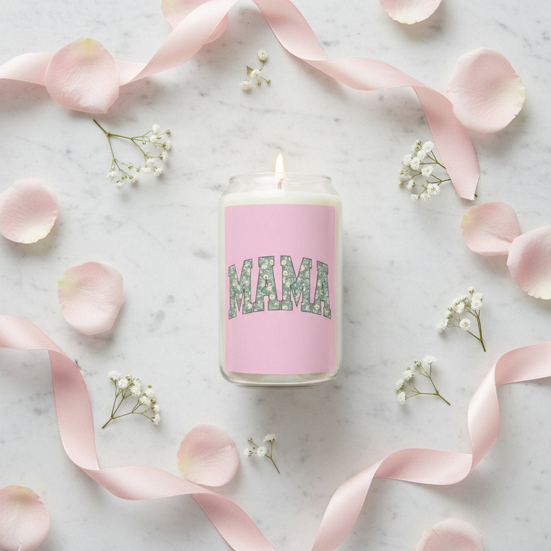 Overhead flat lay of MAMA floral soy candle on white marble surrounded by pink rose petals, baby's breath, and satin ribbon, Mother's Day candle gift