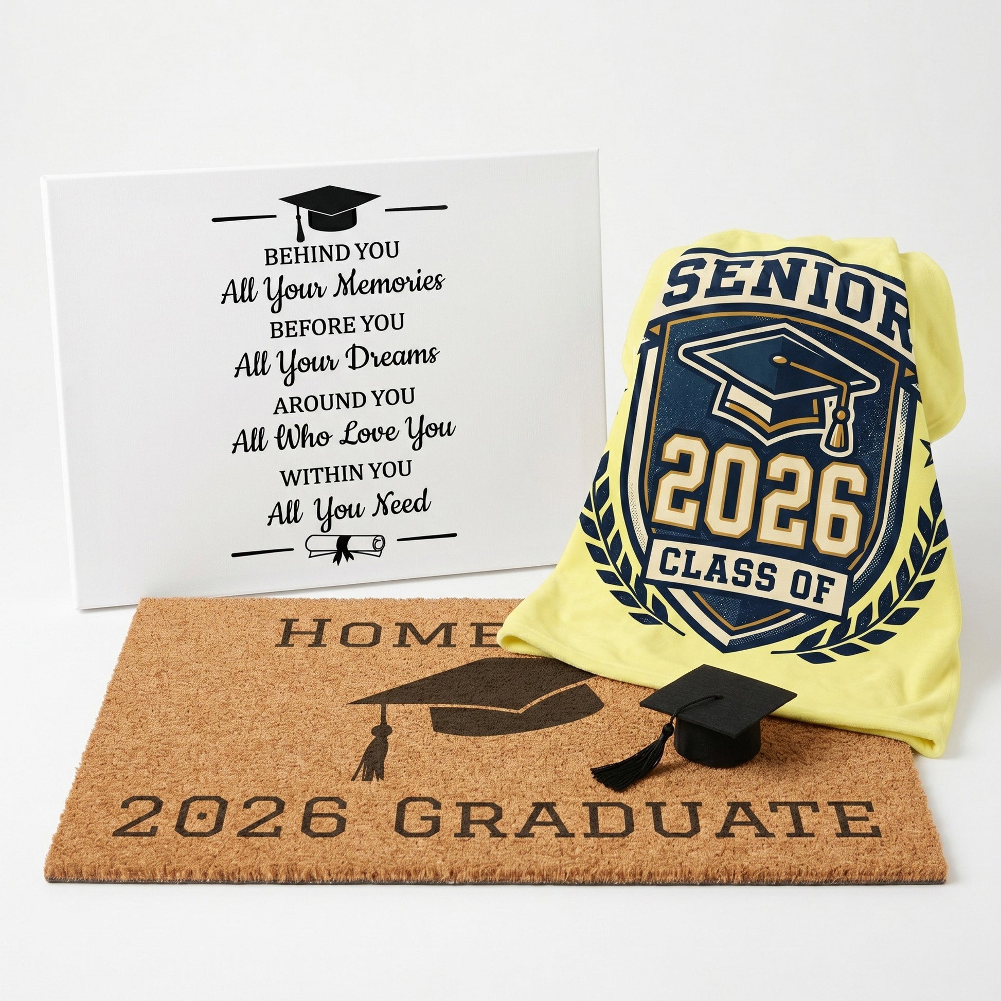 Graduation-themed items including a yellow blanket, doormat, and canvas with graduation quote on a white background.